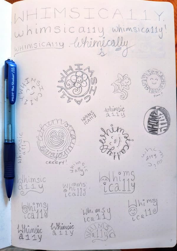 A sketchbook full of pencil drawn attempts at a Whimsica11y logo. Some circular, some floral, one creepy, one a beach-ball, some trying to do fun typography, or cute cursive, and several smiley faces.